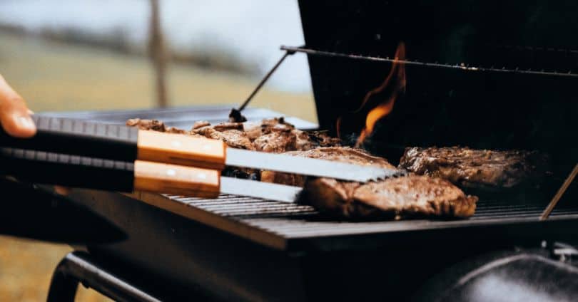 tongs tending bbq food