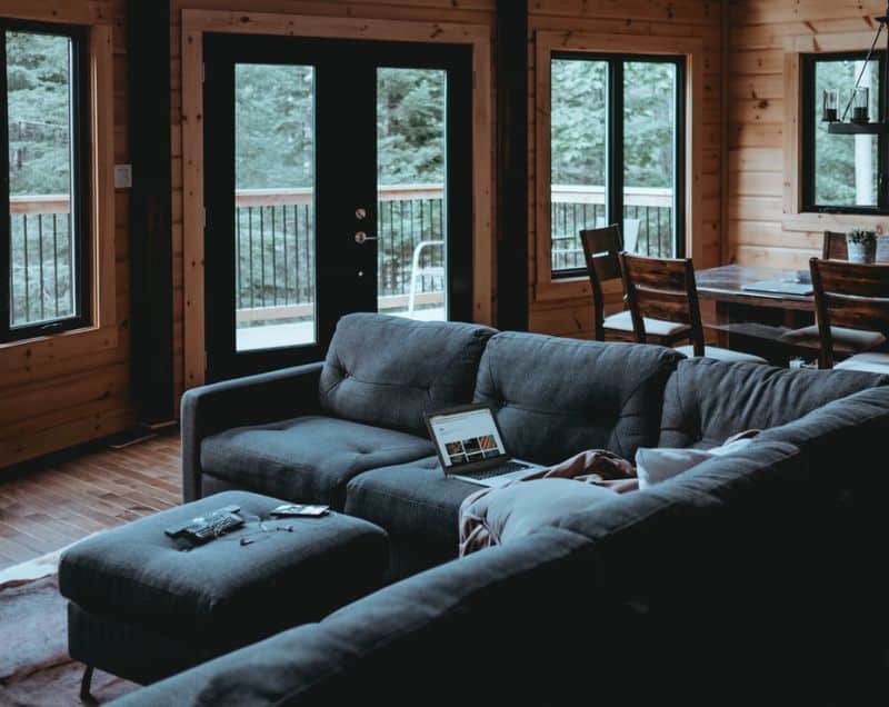 log cabin interior with l-shape sofa