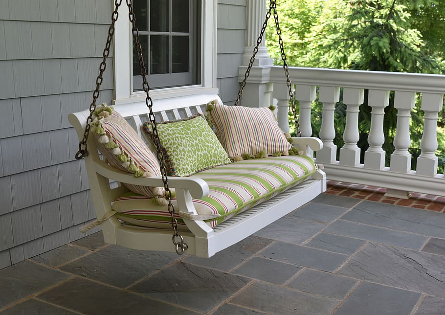 DIY porch swing with colourful cushions