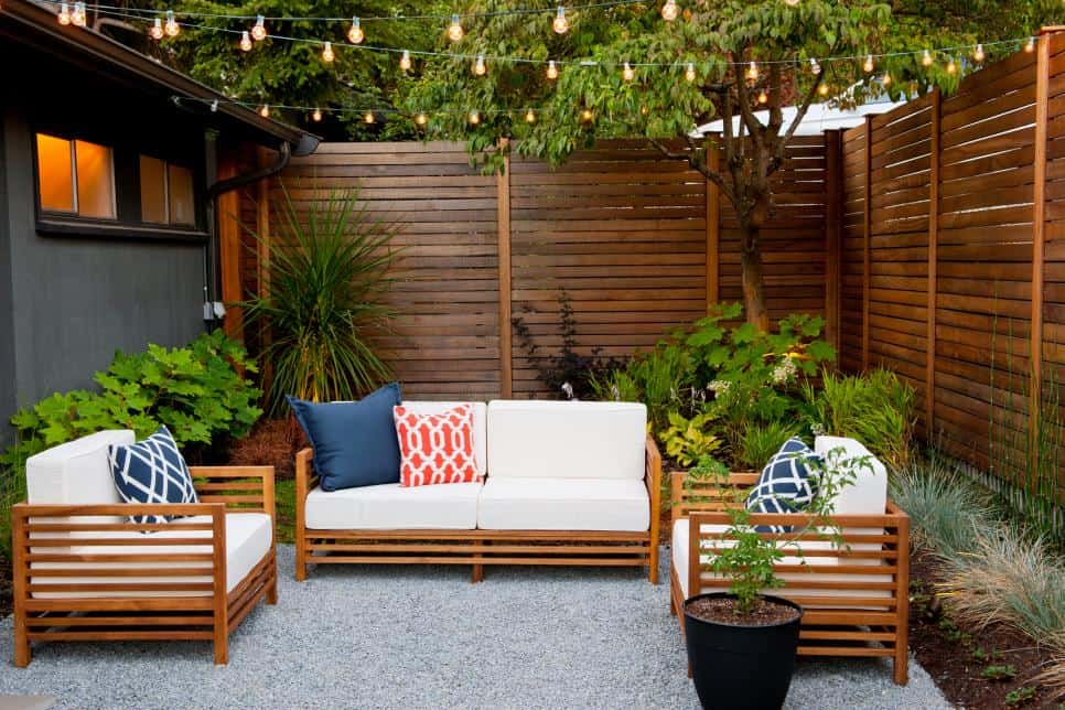 Dark stained fence boards create a private patio in this modern back yard