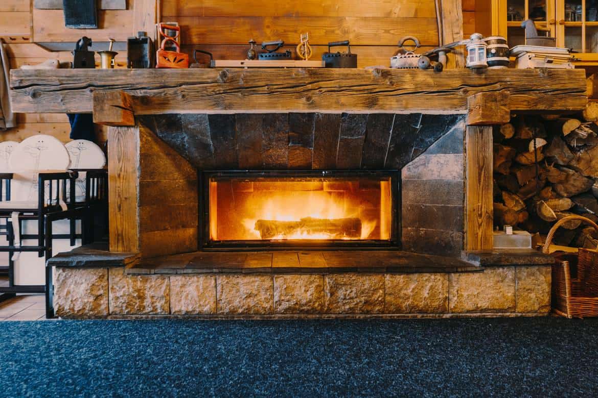 Low-cost heating alternative log cabin fireplace