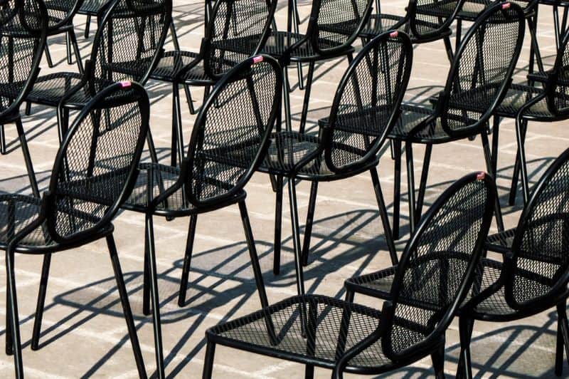 Metal (aluminium) garden furniture in rows of chairs