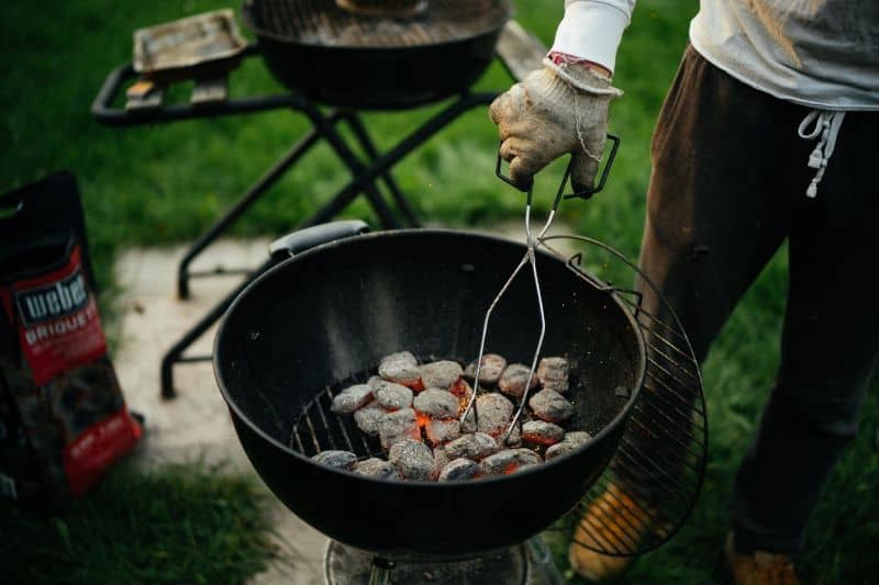 Prepping the charcoal briquettes for BBQ grilling