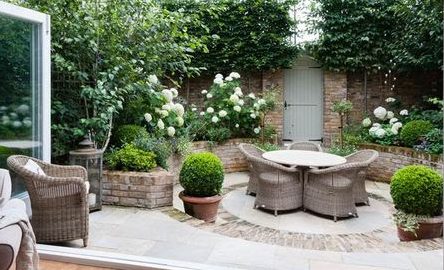 Rattan garden furniture set with round table