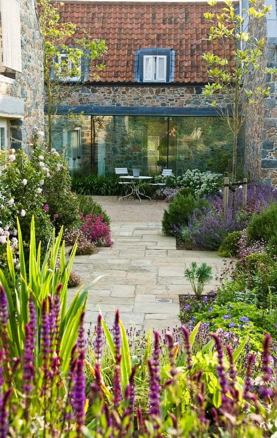 A cheerful-looking courtyard with plenty of colourful flowers