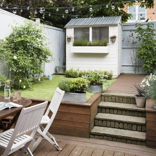 A small backyard space with a two-tier garden,