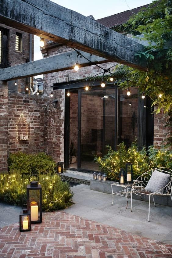 Outdoor space with wooden beams and fairy lights