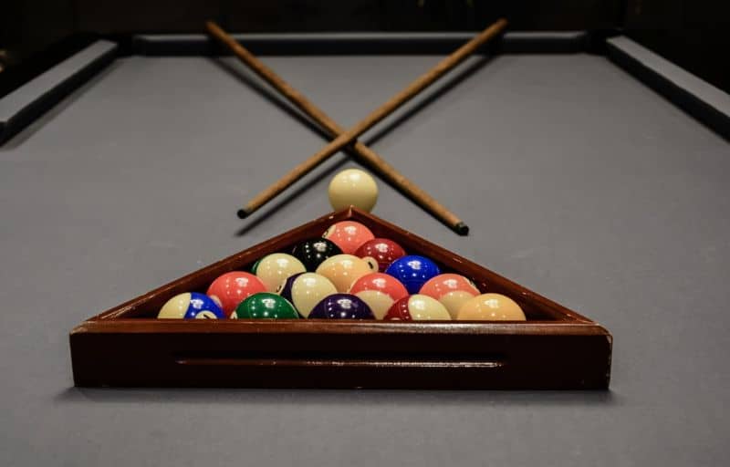 A billiard table with billiard balls