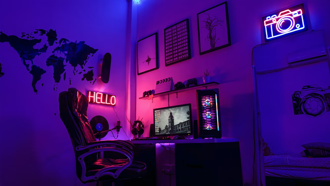 Mini gaming room lit with gradient neon lights