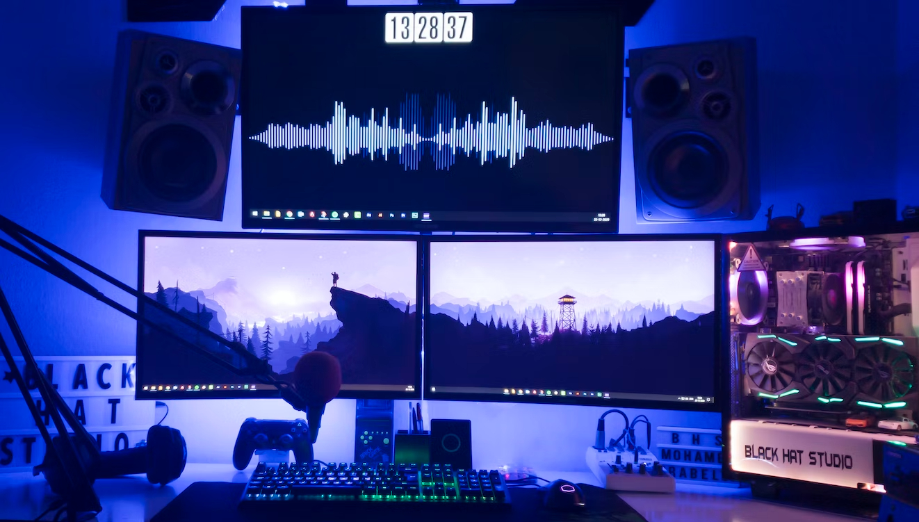 Two gaming monitors with surrounding large speakers
