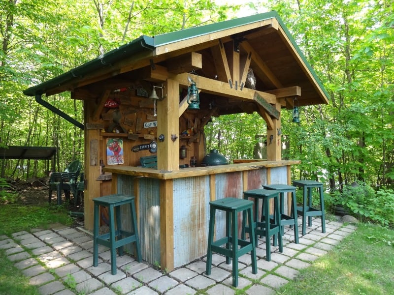 A garden bar with a view of a forest