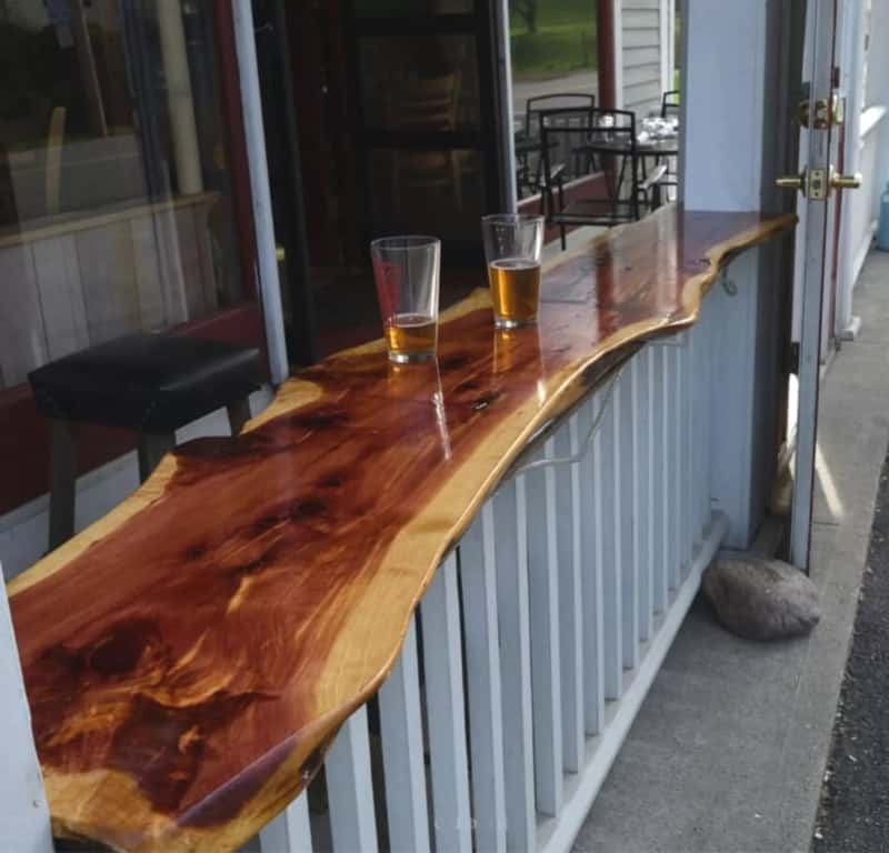 Red cedar bar top with half drunk pints