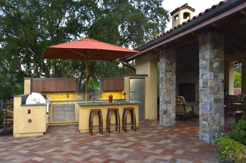 A Mediterranean outdoor pub with incorporated with ceramics, woods, and wrought iron
