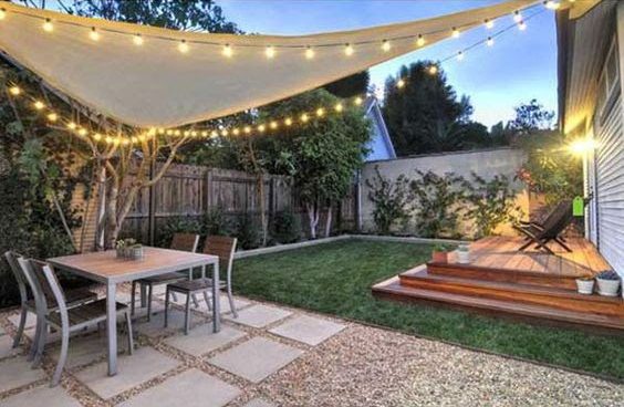 Sail with lights providing a shaded area and perfect entertaining space in the garden