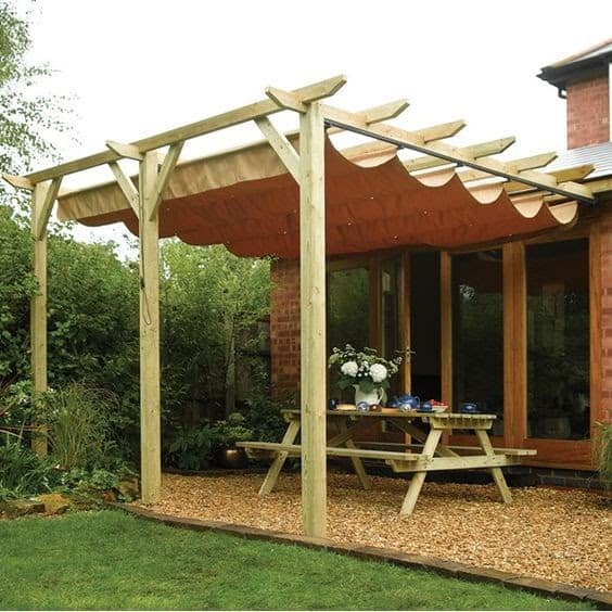 A wooden pergola and hanging fabric canopy, giving off a Mediterranean vibe