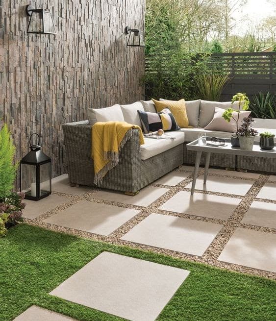A perfect outdoor space set-up with garden furniture and accessories with earth tone colour pallet