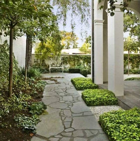A classic looking stone path that leads to the garden