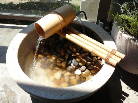 A piece of bamboo used as a mini fountain