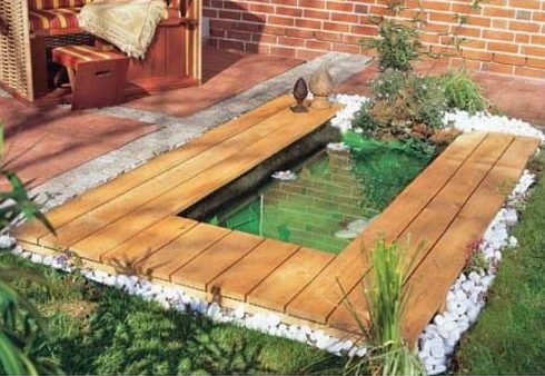 A pond with wooden elements