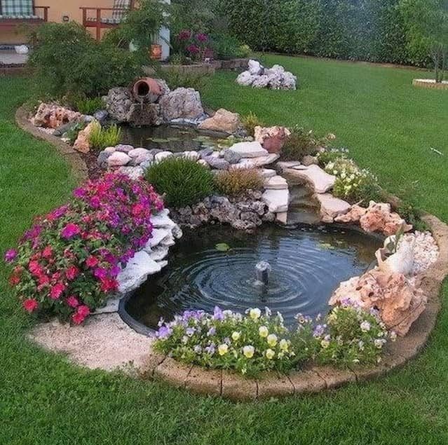 Small, double garden pond with waterfall and fountain
