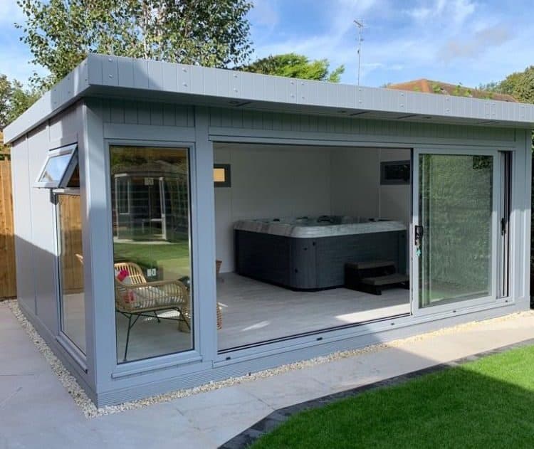 A garden room with a hot tub installed inside
