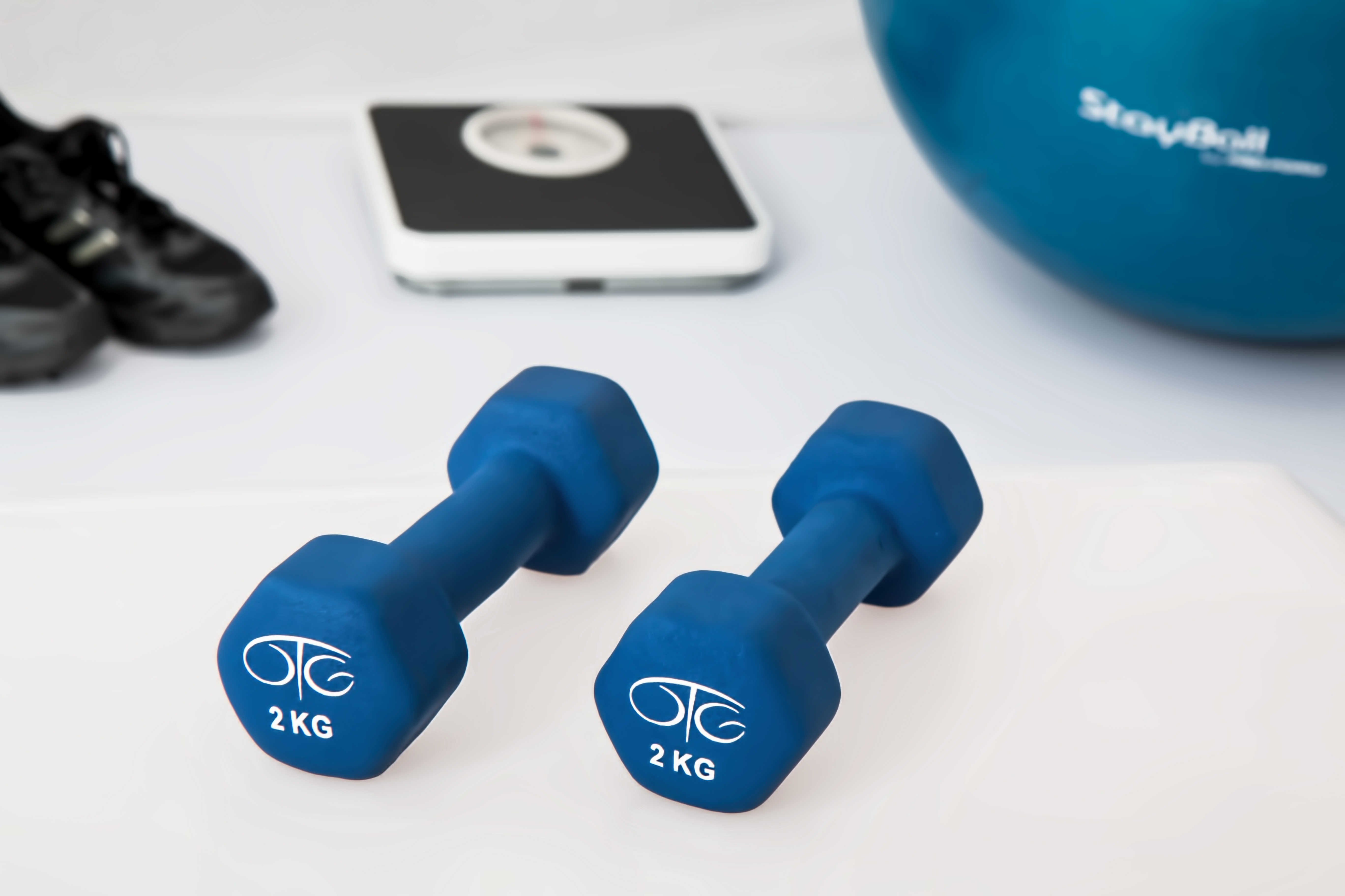 Mini dumbbells, weighing scales and gym ball