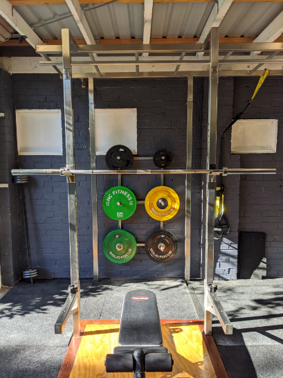 A squat rack at a garage gym