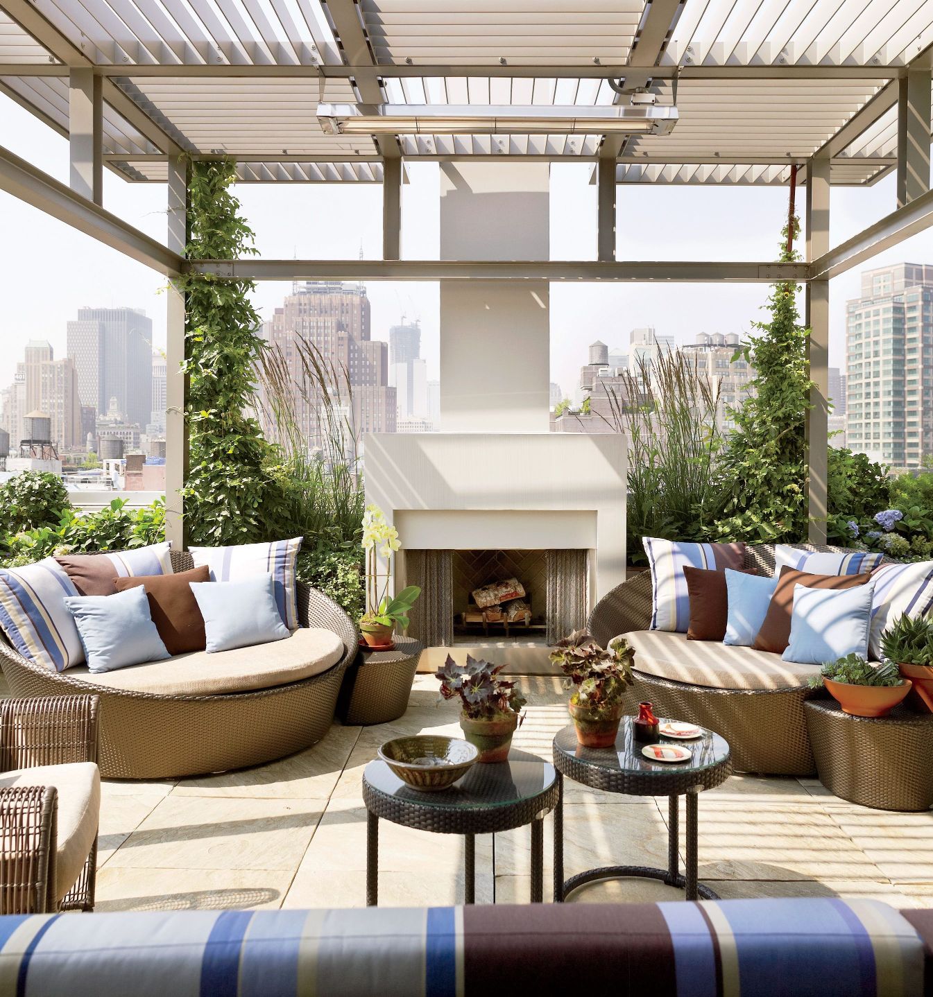 Refined rooftop hangout area with trellis and fireplaces