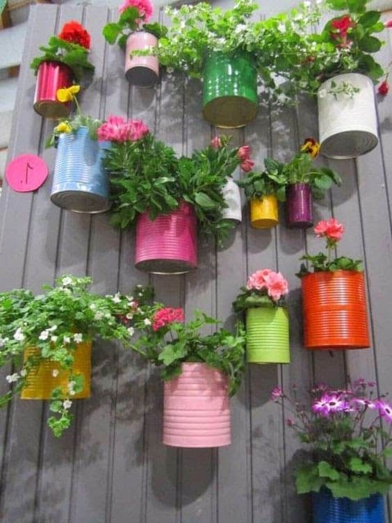 DIY colourful old cans as plant pots