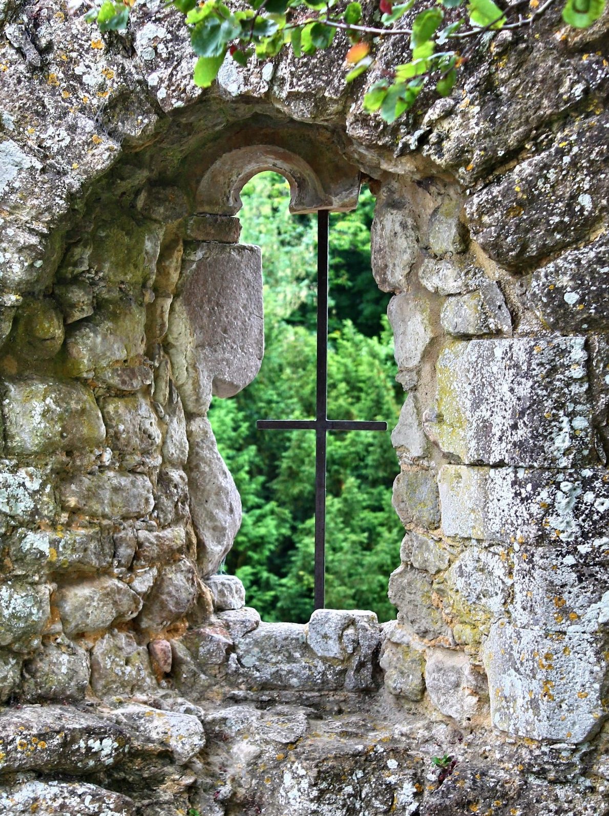 Stone garden wall with a whimsical window
