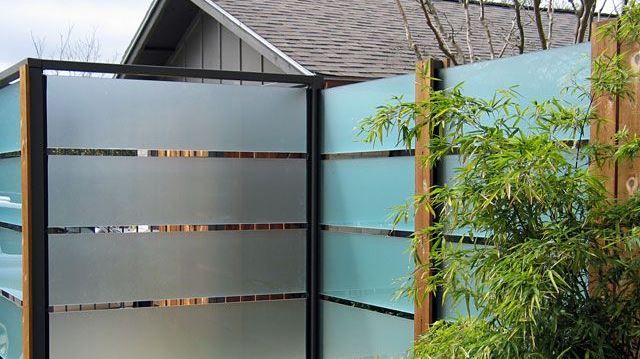 Garden fence made with metal and glass