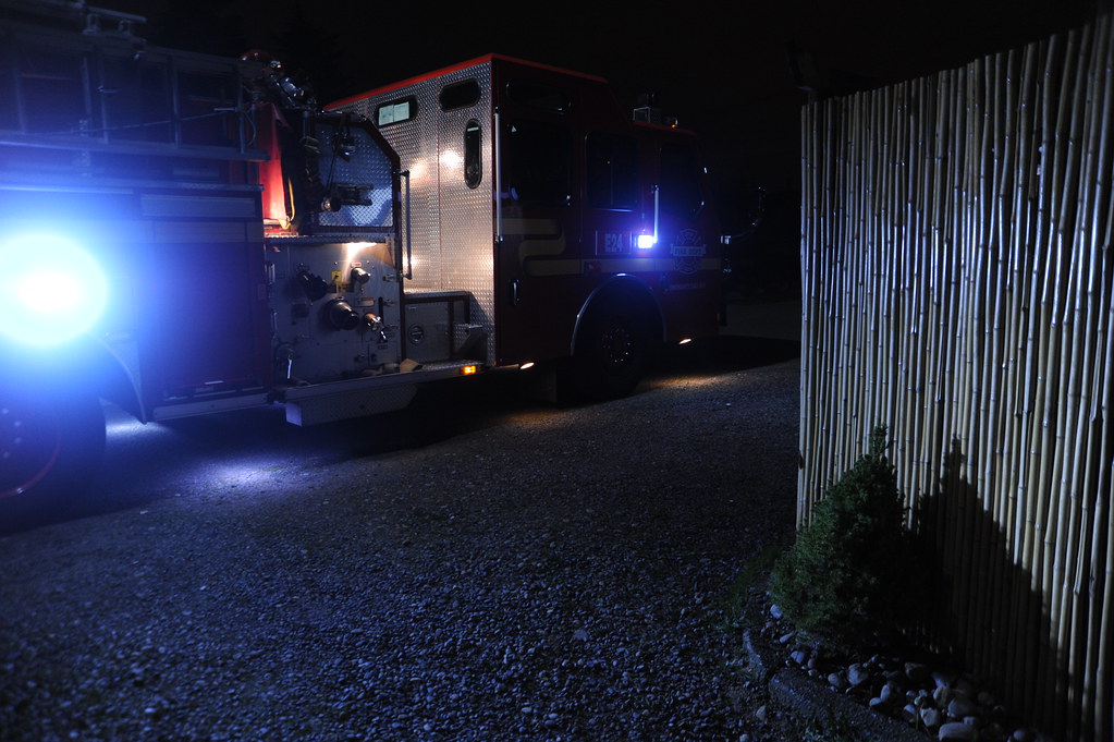 Truck passing through a gravel driveway at night