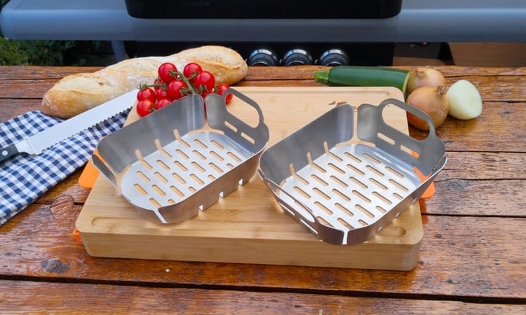 grill baskets on chopping board surrounded by bread and oven