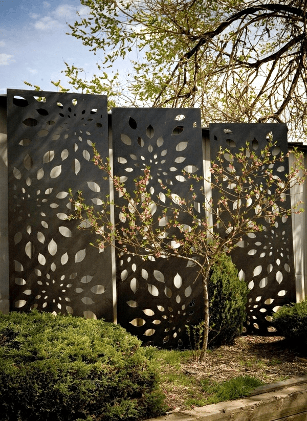 decorative metal screens in front of a house