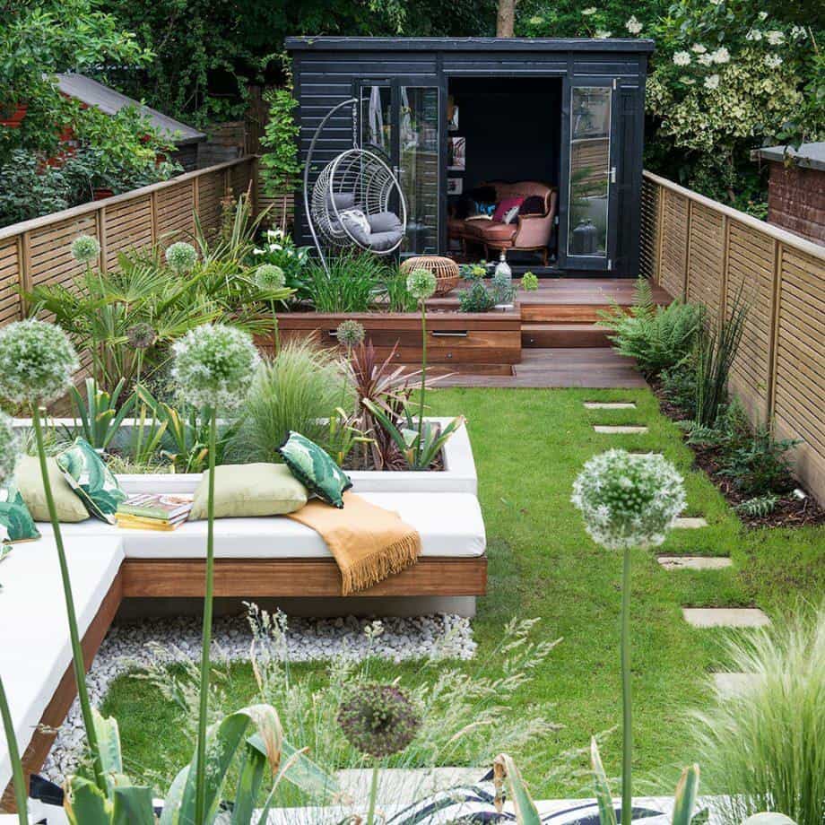 Multi-zone garden with shed and hanging chair at the end of the garden