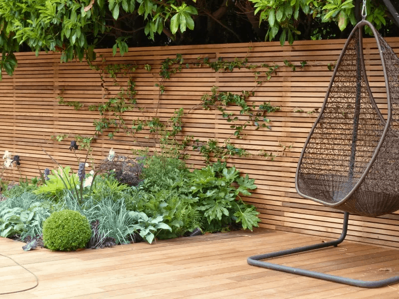 horizontal wooden screening with hanging chair