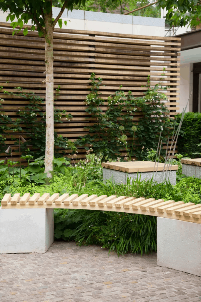 slatted fence panels with a curved patio bench