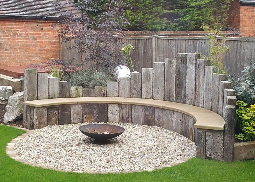 curved seating area with gravel circle and fire pit
