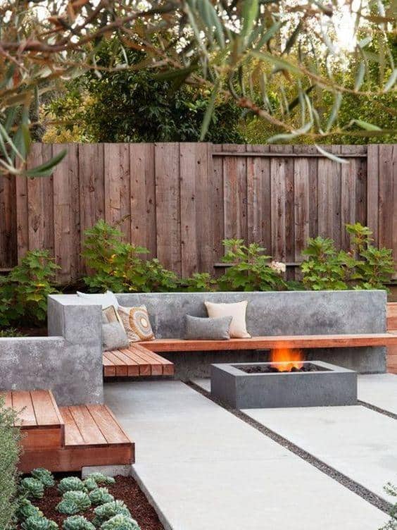 wooden fence and stone fire pit