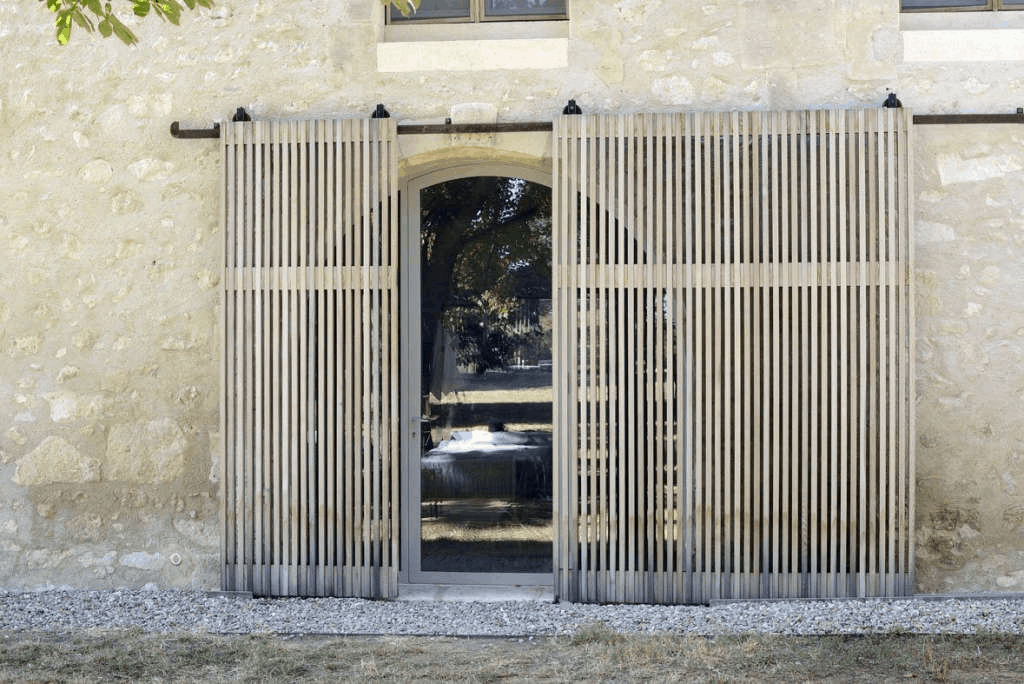 sliding screens in front of a garage