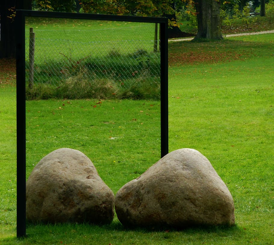 Garden rock facing a mirror