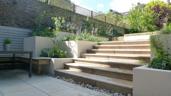 Ivory stone garden stairs with flower beds