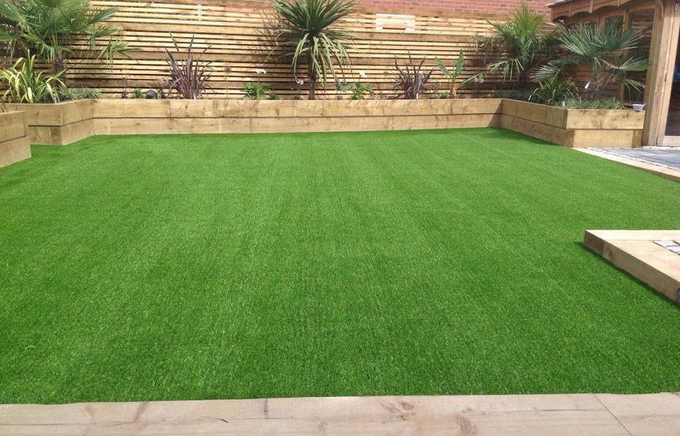 Timber and artificial grass combined in one garden