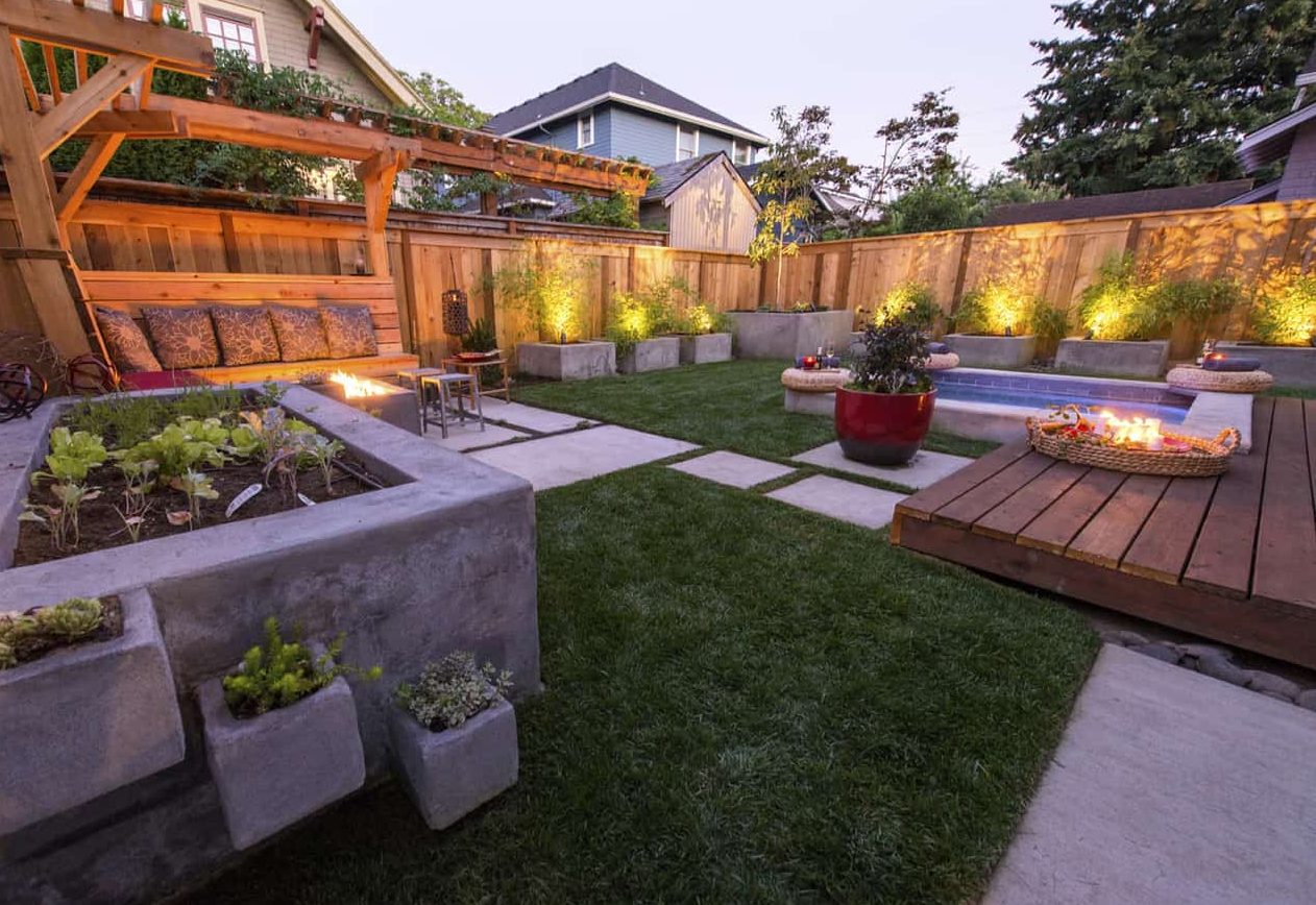 A garden with fire pit and garden beds