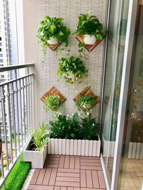 Small garden beds in the corner of a balcony