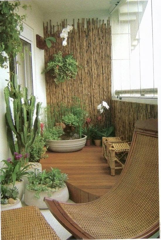 Bamboo sticks sprucing up the plain walls of a balcony