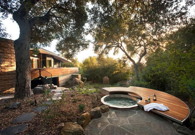 A garden hot tub with a 360 degree view of the forest and the property