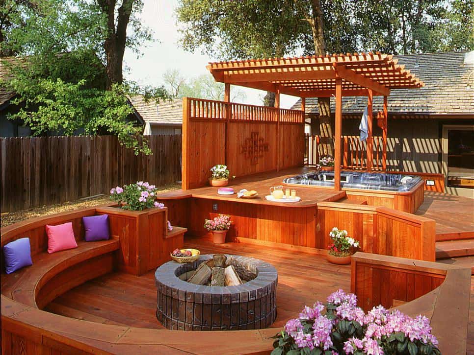Raised short deck with accent seating around a circular firepit