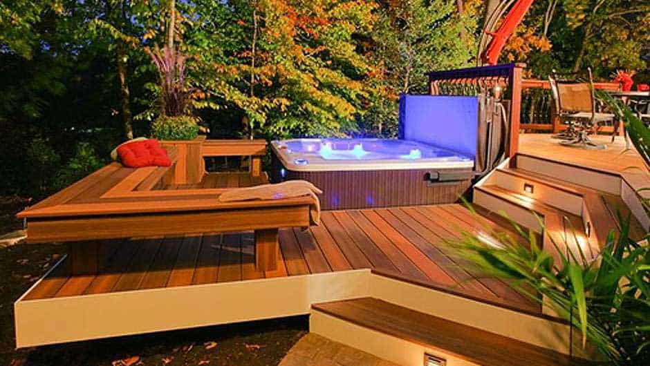 Tiered decks that create divided zones for living spaces, including for hot tub