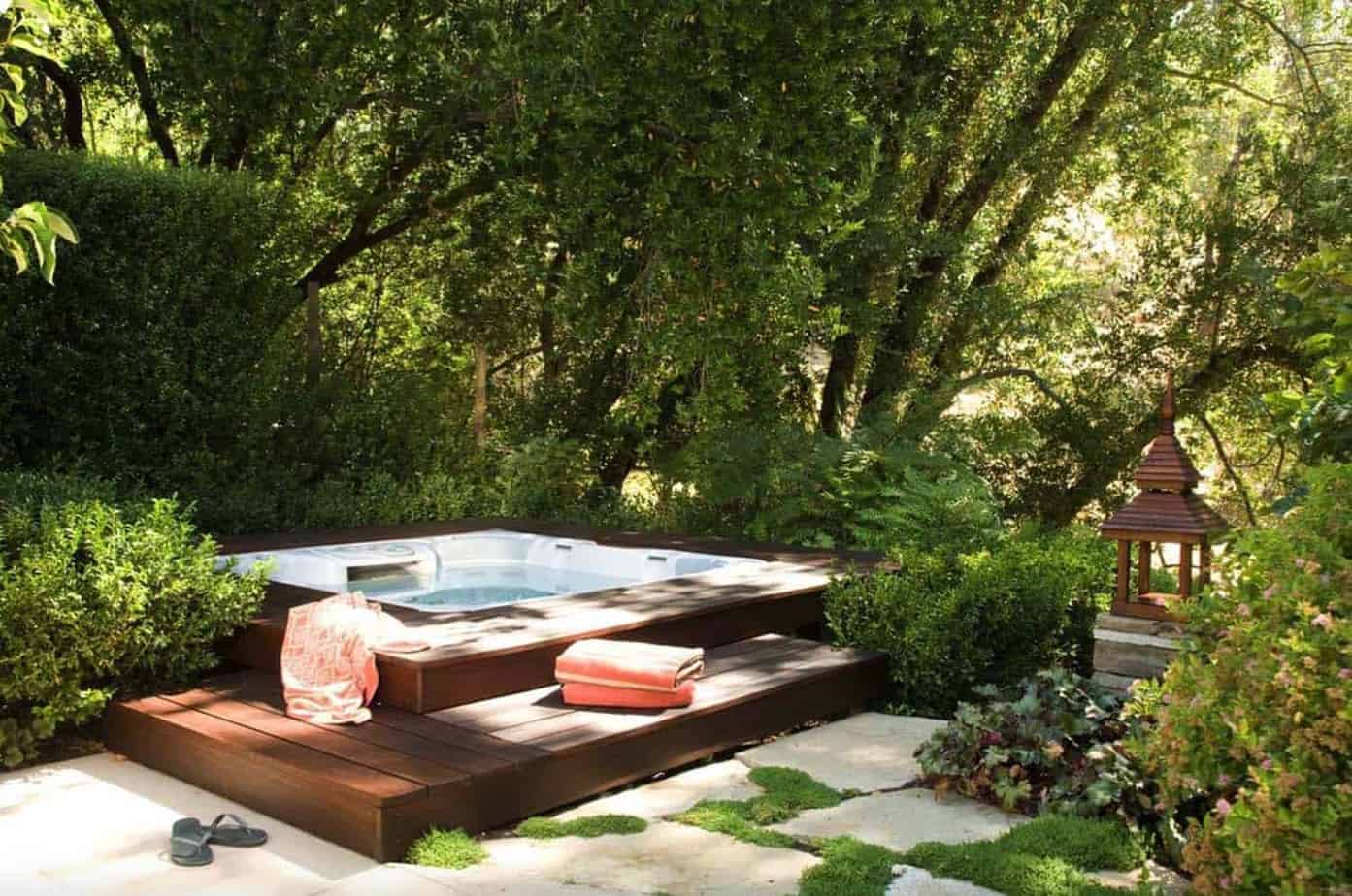 Hot tub deck combined with a landscape, adding natural privacy barrier